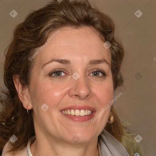 Joyful white adult female with medium  brown hair and grey eyes