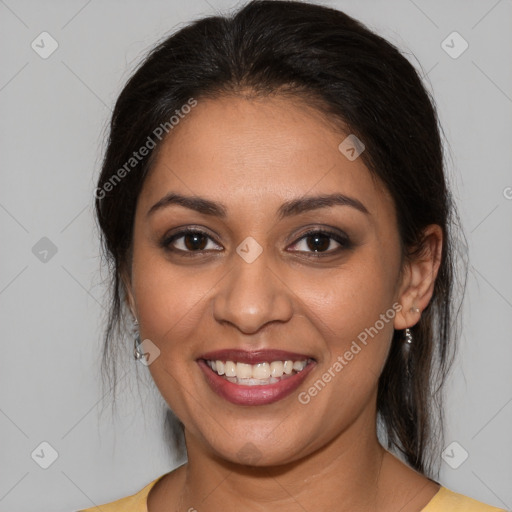 Joyful latino young-adult female with medium  brown hair and brown eyes