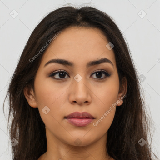 Joyful latino young-adult female with long  brown hair and brown eyes