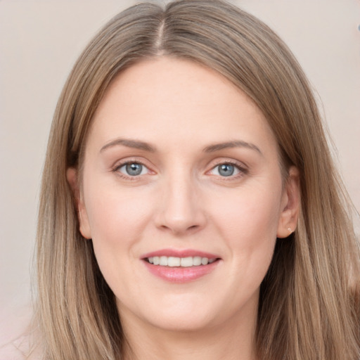 Joyful white young-adult female with long  brown hair and grey eyes