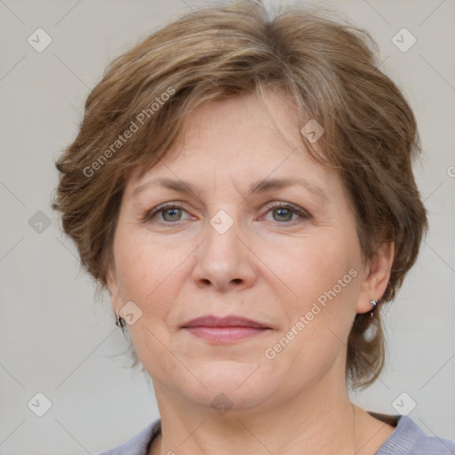 Joyful white adult female with medium  brown hair and grey eyes