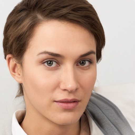 Neutral white young-adult female with short  brown hair and brown eyes