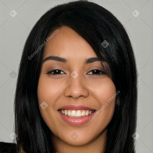 Joyful latino young-adult female with long  black hair and brown eyes