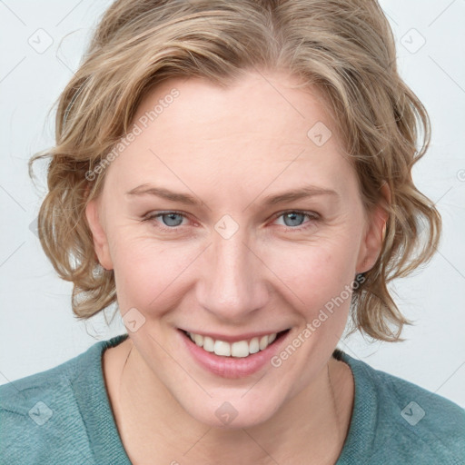 Joyful white young-adult female with medium  brown hair and blue eyes