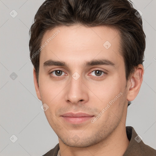 Neutral white young-adult male with short  brown hair and brown eyes