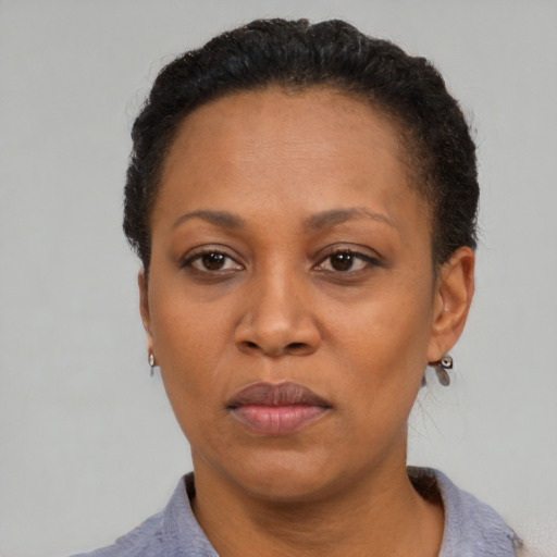 Neutral black adult female with short  black hair and brown eyes