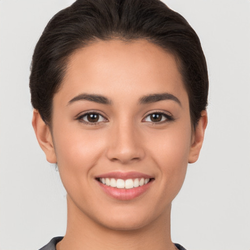 Joyful white young-adult female with short  brown hair and brown eyes