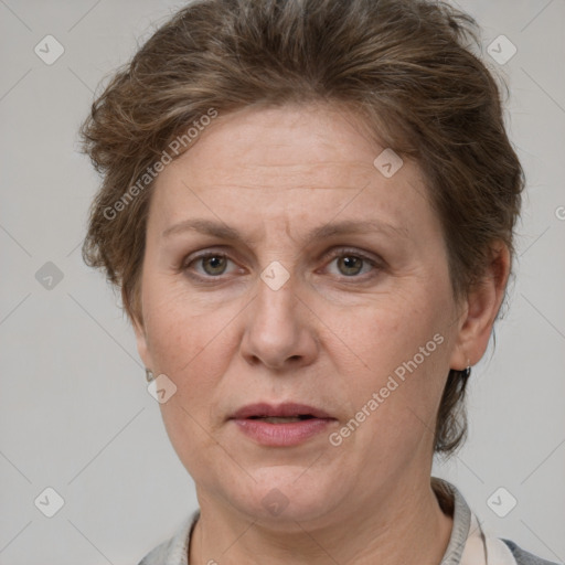 Joyful white adult female with short  brown hair and grey eyes