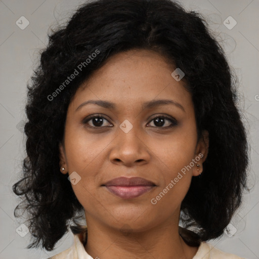 Joyful black young-adult female with medium  brown hair and brown eyes