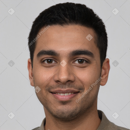 Joyful latino young-adult male with short  black hair and brown eyes