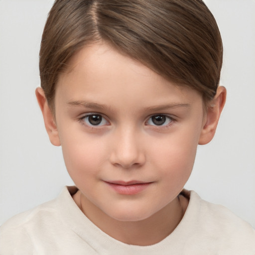 Joyful white child female with short  brown hair and brown eyes