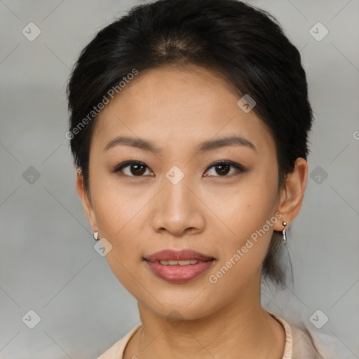 Joyful asian young-adult female with short  black hair and brown eyes