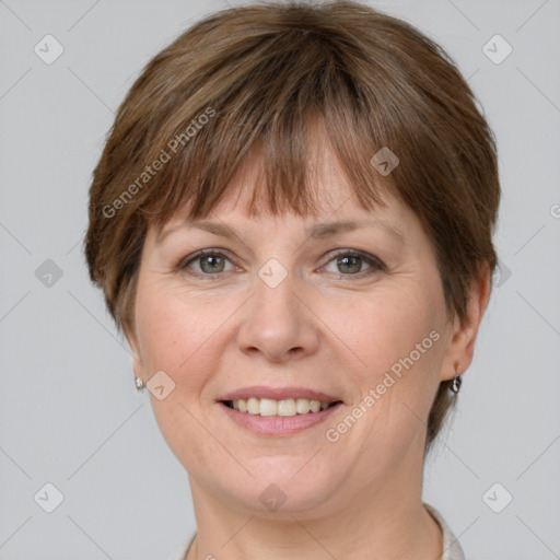 Joyful white adult female with short  brown hair and grey eyes