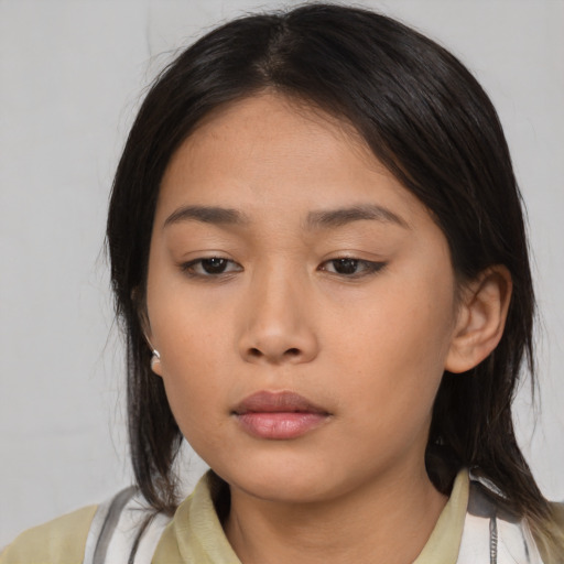Neutral asian young-adult female with medium  brown hair and brown eyes