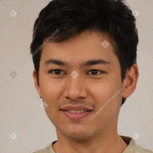 Joyful asian young-adult male with short  brown hair and brown eyes