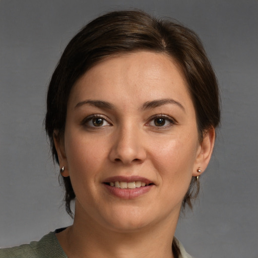 Joyful white young-adult female with medium  brown hair and brown eyes