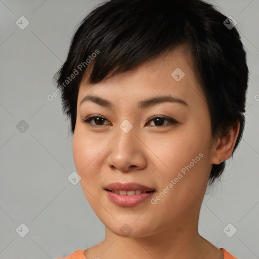 Joyful asian young-adult female with short  brown hair and brown eyes