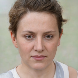 Joyful white adult female with short  brown hair and brown eyes