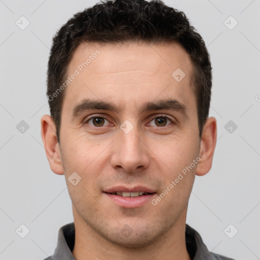 Joyful white young-adult male with short  brown hair and brown eyes