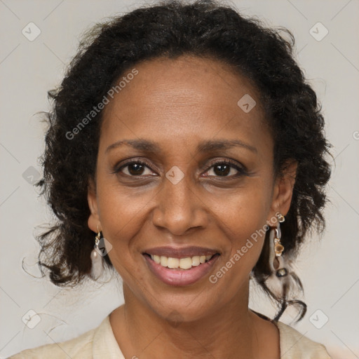 Joyful black adult female with medium  brown hair and brown eyes