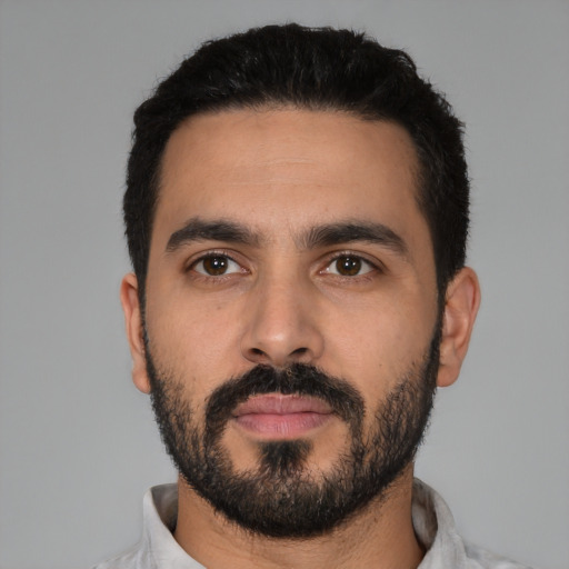 Neutral latino young-adult male with short  black hair and brown eyes