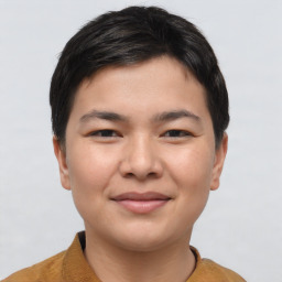 Joyful asian young-adult male with short  brown hair and brown eyes