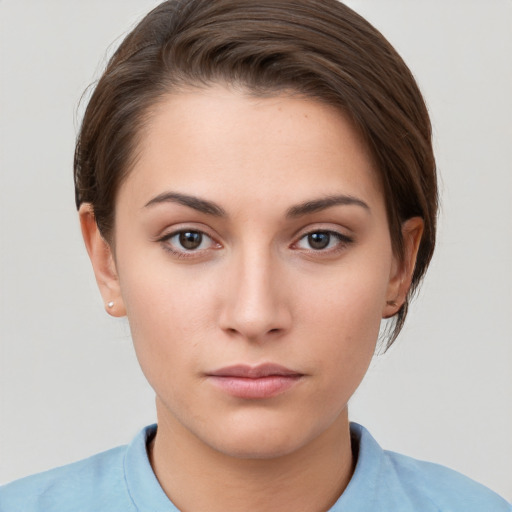 Neutral white young-adult female with short  brown hair and brown eyes