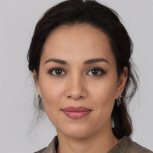 Joyful white young-adult female with medium  brown hair and brown eyes