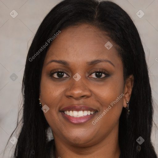 Joyful black young-adult female with long  brown hair and brown eyes