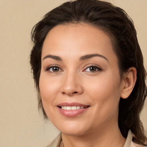 Joyful white young-adult female with medium  brown hair and brown eyes