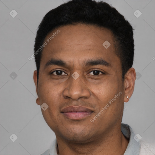 Joyful latino young-adult male with short  brown hair and brown eyes