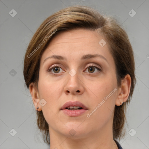 Joyful white adult female with medium  brown hair and brown eyes