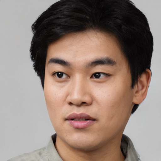 Neutral asian young-adult male with short  black hair and brown eyes