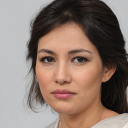 Joyful asian young-adult female with medium  brown hair and brown eyes
