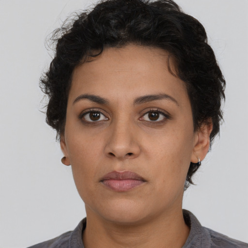 Neutral latino young-adult female with short  brown hair and brown eyes