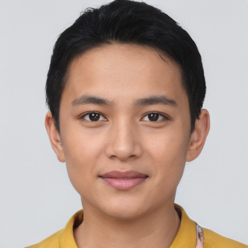 Joyful asian young-adult male with short  black hair and brown eyes