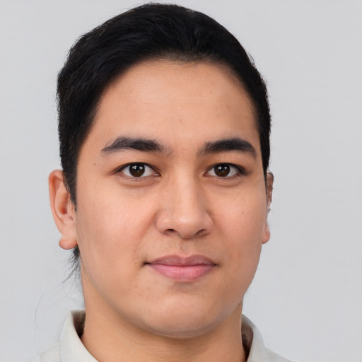 Joyful asian young-adult male with short  brown hair and brown eyes