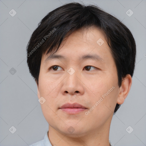 Neutral asian adult male with short  brown hair and brown eyes