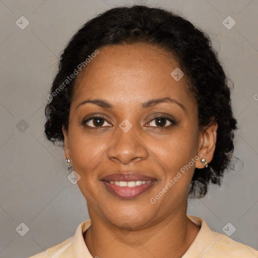 Joyful black adult female with medium  black hair and brown eyes