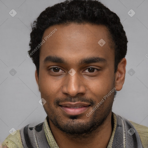 Joyful black young-adult male with short  black hair and brown eyes