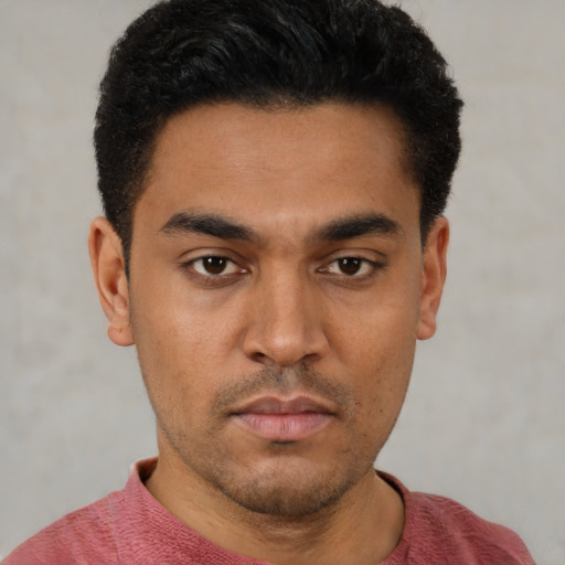 Neutral latino young-adult male with short  black hair and brown eyes