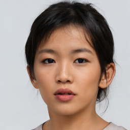 Neutral asian young-adult female with medium  brown hair and brown eyes