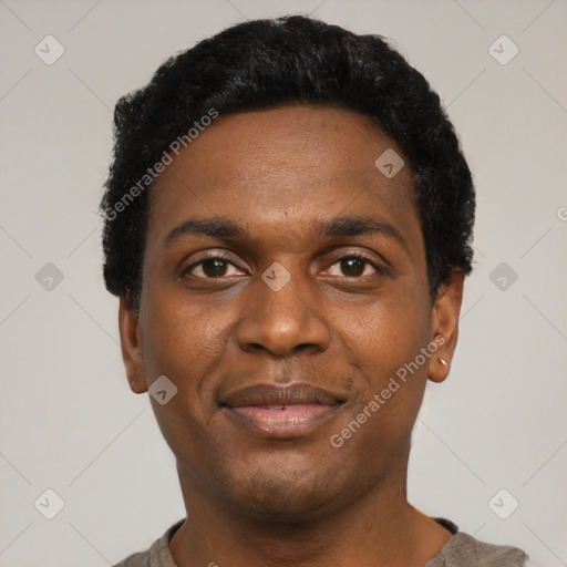 Joyful black young-adult male with short  black hair and brown eyes