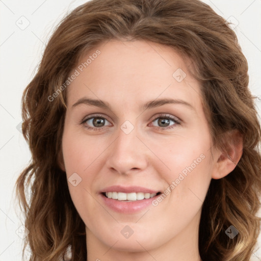 Joyful white young-adult female with long  brown hair and green eyes