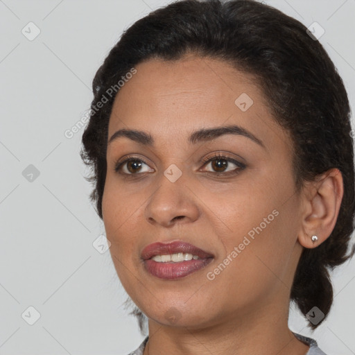 Joyful black young-adult female with medium  brown hair and brown eyes