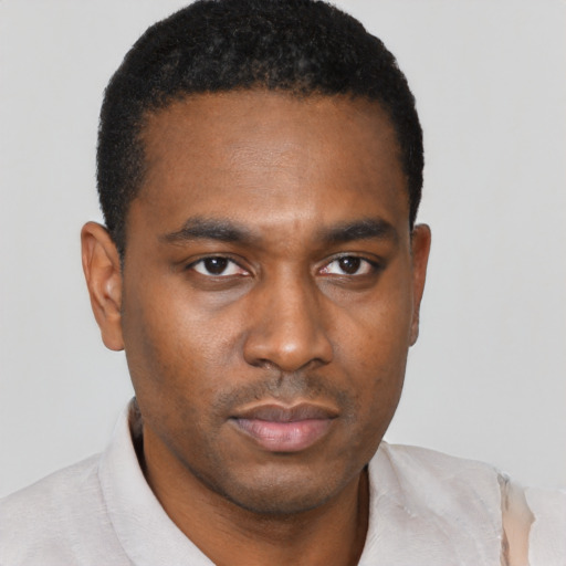 Neutral black young-adult male with short  black hair and brown eyes