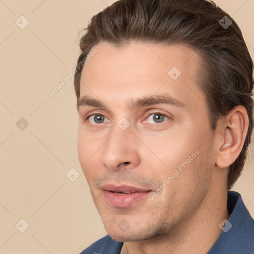 Joyful white young-adult male with short  brown hair and brown eyes