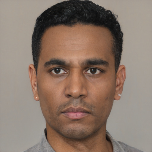 Neutral latino young-adult male with short  black hair and brown eyes