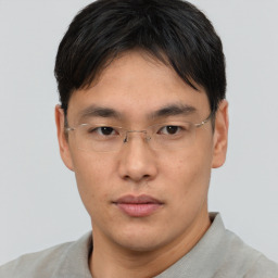 Neutral asian young-adult male with short  brown hair and brown eyes