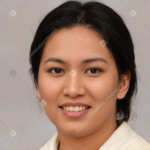 Joyful asian young-adult female with medium  brown hair and brown eyes